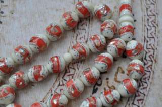 Strand of 33 Camel Bone beads with mother of pearl and silver color 