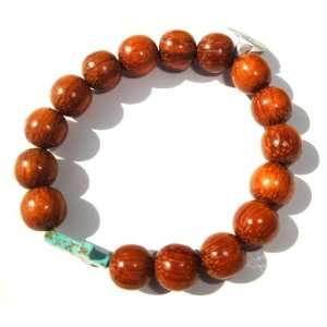   Wood bead Bracelet Accentuated By A 10mm Turquoise Cross: Jewelry