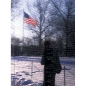  The American Flag Reflects into the Vietnam Memorial 