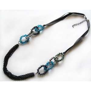 Black, Turquoise, Silver and Slight Green Cut Crystal Beads on Black 