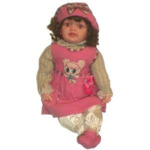  21 inch baby doll in pink dress, hat and brown curly hair 